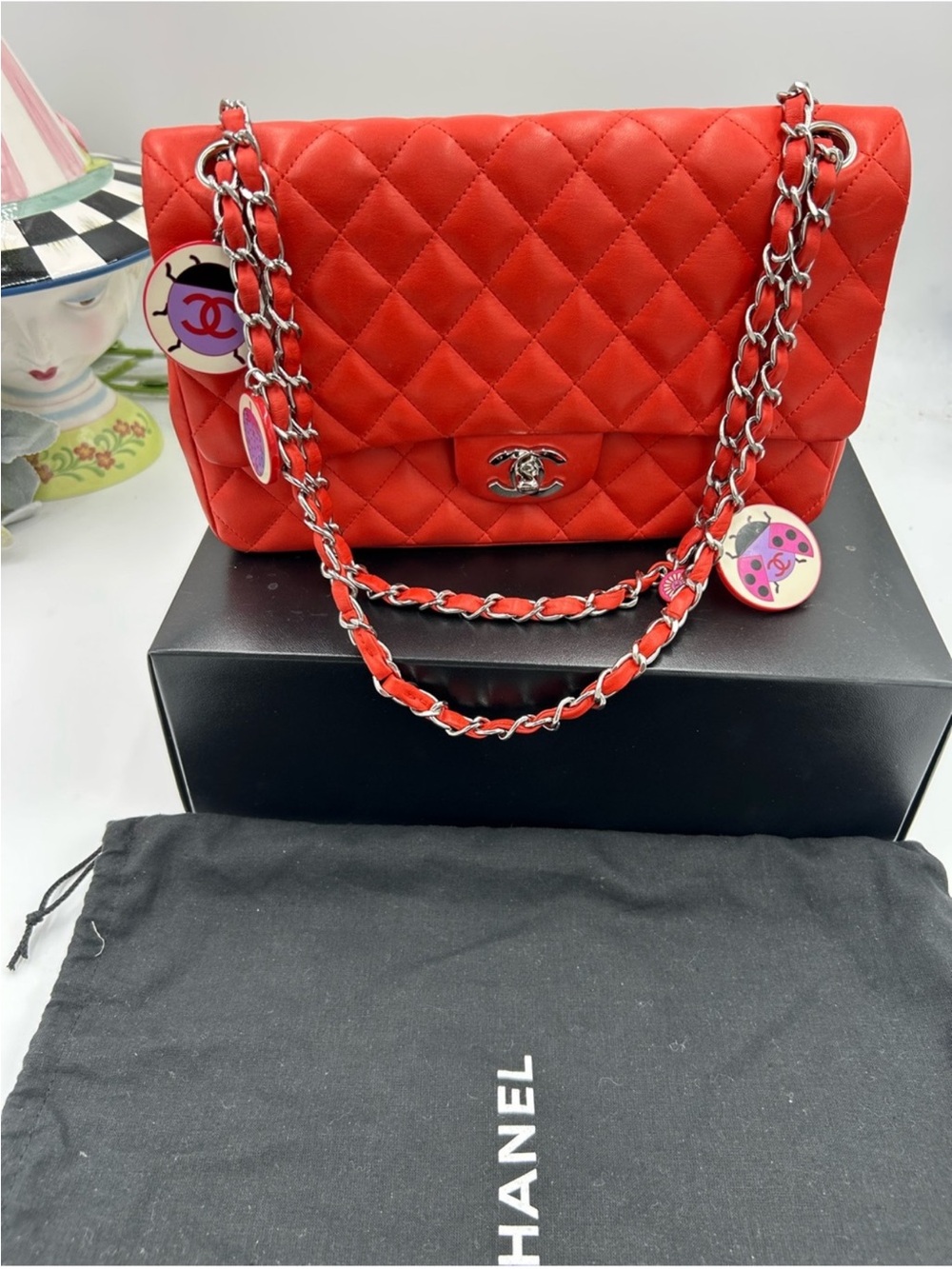 Chanel Quilted MATELASSE Classic Flap Bag in Red with Silver Chain AND CHARMS .
